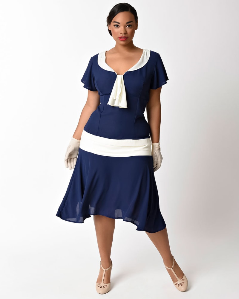 Front of a model wearing a size XL Unique Vintage 1920s Navy Blue & Ivory Wilshire Flapper Day Dress in Navy/White by Unique Vintage. | dia_product_style_image_id:298530